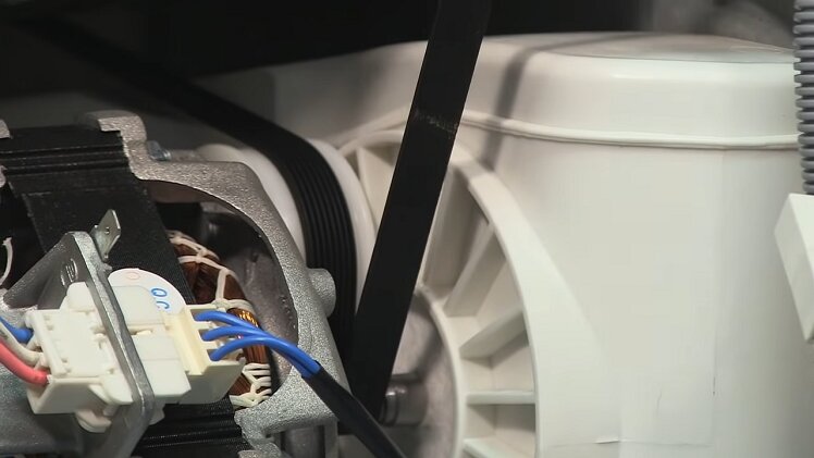 Worn-out belt tension pulley.