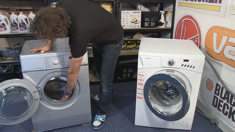 Inspecting a washing machine drum.