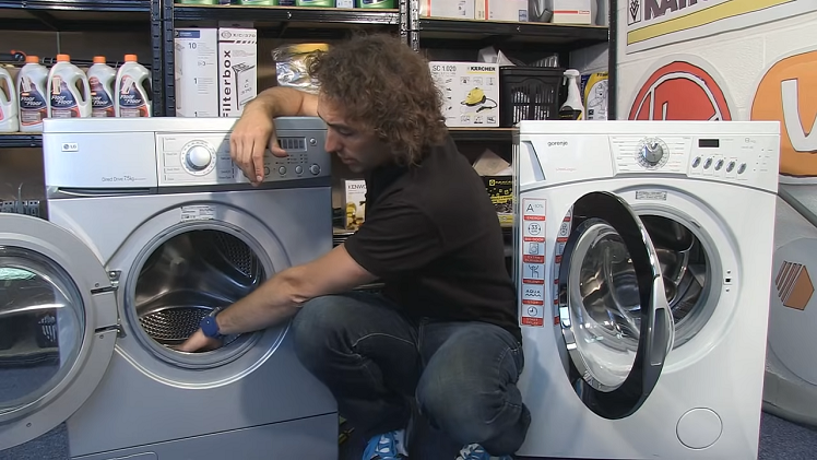 Inspecting the drum for trapped items.