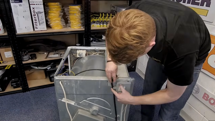 Refit the two hoses onto the water container.