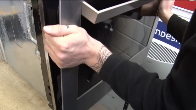 Lift the oven door up and away.