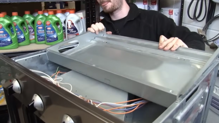 Refit the panels on the oven.