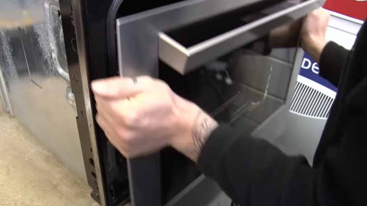 Take the door out of the oven.